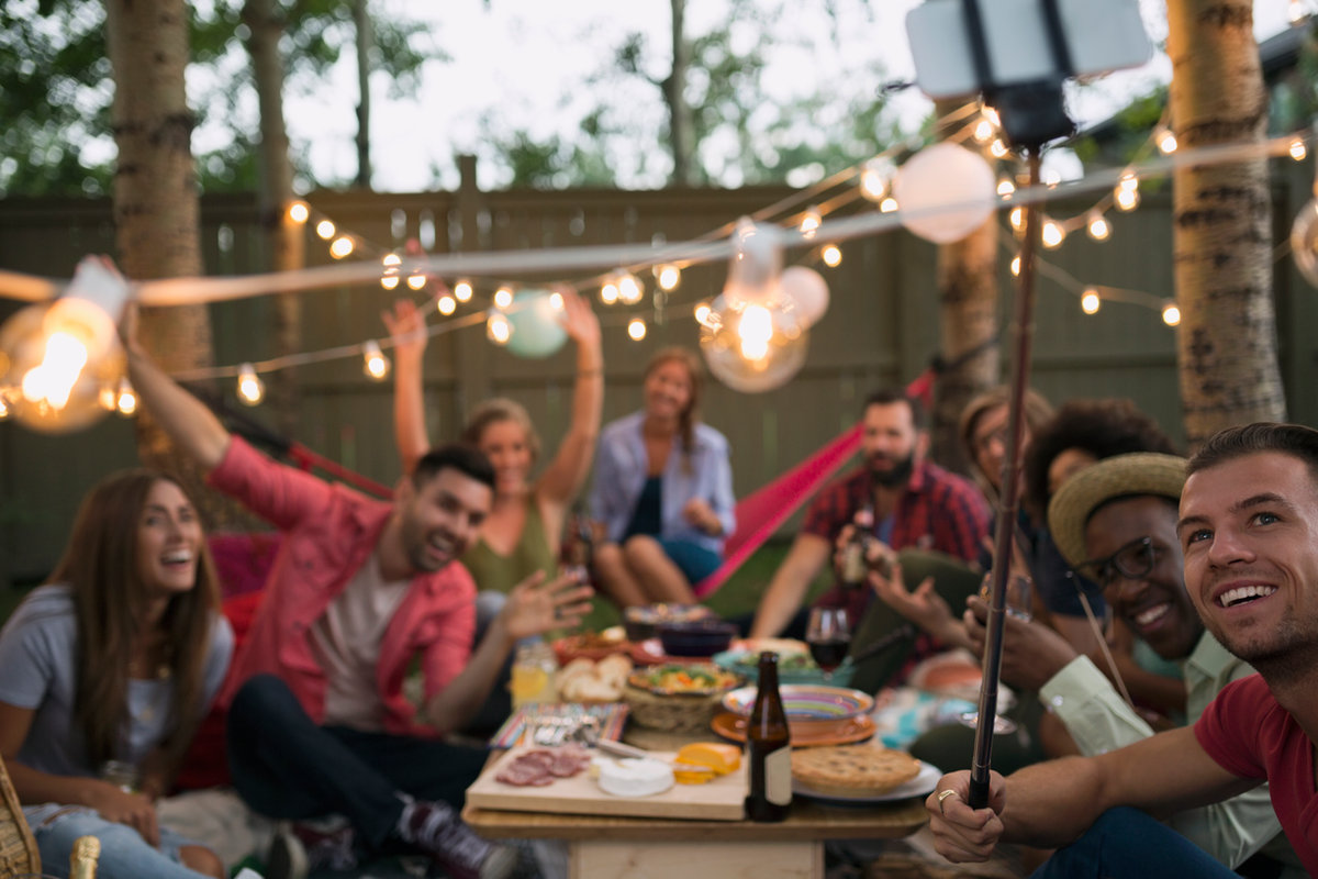 Guests together under string lights at Boston Homestel